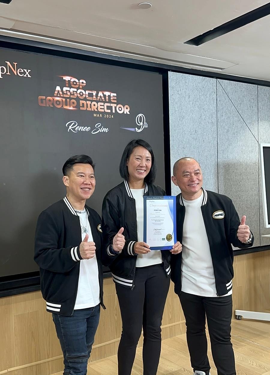 Renee Sim holding a framed certificate on stage with two PropNex colleagues, beneath a screen reading "Top Associate Group Director, March 2024, Renee Sim, 9th".